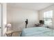Bedroom with a full bed, desk and window at 16245 W Culver St, Goodyear, AZ 85338