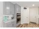 Kitchen with double ovens, gray cabinets and marble countertops at 16245 W Culver St, Goodyear, AZ 85338