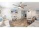 Relaxing living room with light-colored sofas and a large flat-screen TV at 16245 W Culver St, Goodyear, AZ 85338