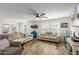 Comfortable living room featuring neutral-toned sofas and ample natural light at 16245 W Culver St, Goodyear, AZ 85338