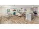 Open-concept kitchen and living area with modern appliances and a neutral color palette at 16245 W Culver St, Goodyear, AZ 85338