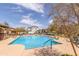 Community swimming pool with lounge chairs and patio at 16245 W Culver St, Goodyear, AZ 85338