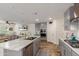 Modern kitchen with gray cabinets, marble countertops, and stainless steel appliances at 16245 W Culver St, Goodyear, AZ 85338