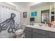 Bathroom with gray vanity, toilet and octopus shower curtain at 16245 W Culver St, Goodyear, AZ 85338