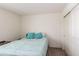 Bedroom with a full bed and light teal bedding at 16245 W Culver St, Goodyear, AZ 85338