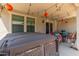 Covered patio with hot tub, seating area, and string lights at 16245 W Culver St, Goodyear, AZ 85338