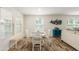 Cozy dining area with a charming wooden table and bench seating near windows at 16245 W Culver St, Goodyear, AZ 85338