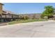 Landscaped community entrance with paved pathways and grassy areas at 16245 W Culver St, Goodyear, AZ 85338