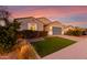 Single story home with a 2-car garage and nicely landscaped lawn at 4156 E Nokota Rd, San Tan Valley, AZ 85140