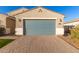 One-story house with a gray garage door and landscaped yard at 4156 E Nokota Rd, San Tan Valley, AZ 85140