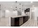 Kitchen island with granite countertop and stainless steel dishwasher at 4156 E Nokota Rd, San Tan Valley, AZ 85140