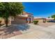 Two story house with tan exterior and landscaping at 640 W Barrus St, Casa Grande, AZ 85122