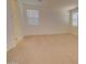 Bright bedroom with neutral carpeting and ample space at 1122 E Meadowbrook Dr, Casa Grande, AZ 85122