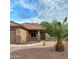 One-story home with a two-car garage and palm tree landscaping at 45737 W Ranch Rd, Maricopa, AZ 85139