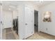 Laundry room with washer, dryer, and extra storage at 45737 W Ranch Rd, Maricopa, AZ 85139