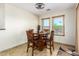 Small breakfast nook with a square table and four chairs at 45737 W Ranch Rd, Maricopa, AZ 85139