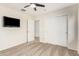 Bedroom with mounted TV and closet at 45737 W Ranch Rd, Maricopa, AZ 85139