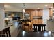 Spacious kitchen with an island, stainless steel appliances, and light wood cabinets at 45737 W Ranch Rd, Maricopa, AZ 85139