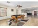 Game room with a pool table and plenty of natural light at 45737 W Ranch Rd, Maricopa, AZ 85139