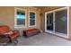 Covered patio with seating and sliding glass doors at 45737 W Ranch Rd, Maricopa, AZ 85139