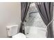 Bathroom with a tub and patterned wall tiles at 45737 W Ranch Rd, Maricopa, AZ 85139