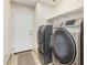 Laundry room with washer, dryer, and exterior access at 45737 W Ranch Rd, Maricopa, AZ 85139