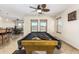 Game room with pool table and adjacent bar/kitchenette at 45737 W Ranch Rd, Maricopa, AZ 85139