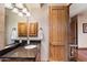 Bathroom with granite countertop, wood cabinets and a view to another room at 25313 N 114Th St, Scottsdale, AZ 85255