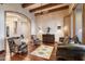 Rustic sitting area with hardwood floors, leather furniture, and southwestern decor at 25313 N 114Th St, Scottsdale, AZ 85255