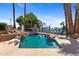 Inviting pool with a rock waterfall feature at 1410 W Sandpiper Dr, Gilbert, AZ 85233