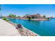 Single-story house on a lake with solar panels at 10923 W Escuda Dr, Sun City, AZ 85373
