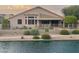 Home with a canal view and a fenced backyard at 10923 W Escuda Dr, Sun City, AZ 85373