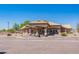 Community clubhouse with fountain and parking at 10923 W Escuda Dr, Sun City, AZ 85373