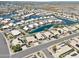 Aerial view of a lakefront community with solar panels at 10923 W Escuda Dr, Sun City, AZ 85373