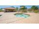 Relaxing community spa with covered seating area at 10923 W Escuda Dr, Sun City, AZ 85373
