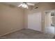 Bedroom with double door closet and carpet at 10923 W Escuda Dr, Sun City, AZ 85373