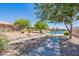 Landscaped walkway along the lake in a community at 10923 W Escuda Dr, Sun City, AZ 85373