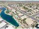 Aerial view of lakefront houses with solar panels at 10923 W Escuda Dr, Sun City, AZ 85373