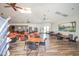 Community room with seating, tables, and a fireplace at 10923 W Escuda Dr, Sun City, AZ 85373