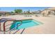 Community spa and pool area with lounge chairs at 10923 W Escuda Dr, Sun City, AZ 85373