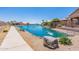 Lakefront walkway with clear water and houses at 10923 W Escuda Dr, Sun City, AZ 85373