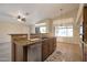 Island kitchen with granite countertops and stainless steel dishwasher at 10923 W Escuda Dr, Sun City, AZ 85373