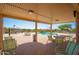 Relaxing pool and patio area with tables and chairs at 10923 W Escuda Dr, Sun City, AZ 85373