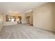 Open living area with a view into the kitchen area at 10923 W Escuda Dr, Sun City, AZ 85373