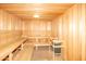 Community sauna with wooden benches and heater at 10923 W Escuda Dr, Sun City, AZ 85373