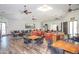 Bright community room with tables and seating areas at 10923 W Escuda Dr, Sun City, AZ 85373