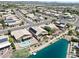 Aerial view of a house with a pool near a lake at 10923 W Escuda Dr, Sun City, AZ 85373