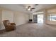 Living room with sliding doors leading to a patio at 10923 W Escuda Dr, Sun City, AZ 85373