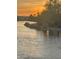 Scenic sunset view over a calm lake at 10923 W Escuda Dr, Sun City, AZ 85373
