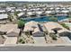 Aerial view of a house near a lake in a residential community at 10923 W Escuda Dr, Sun City, AZ 85373